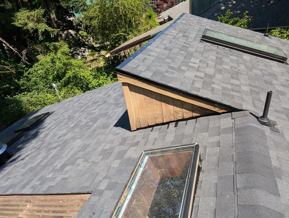 Aerial view of a completed multi-section residential roof in the Willamette Valley