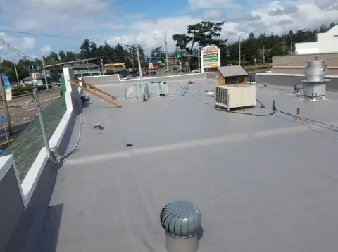 Commercial flat roof project completed by Rain or Shine Roofing