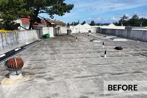 Commercial roof before replacement by Rain or Shine Roofing