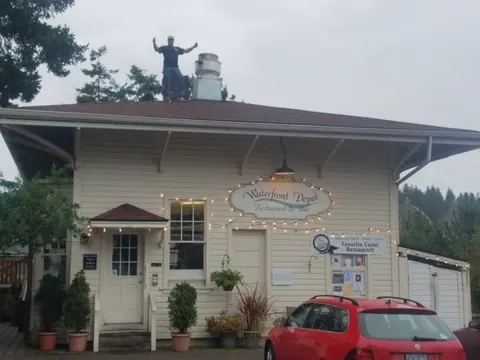 Tim on the Waterfront Depot restaurant roof in Florence after a completed commercial re-roof